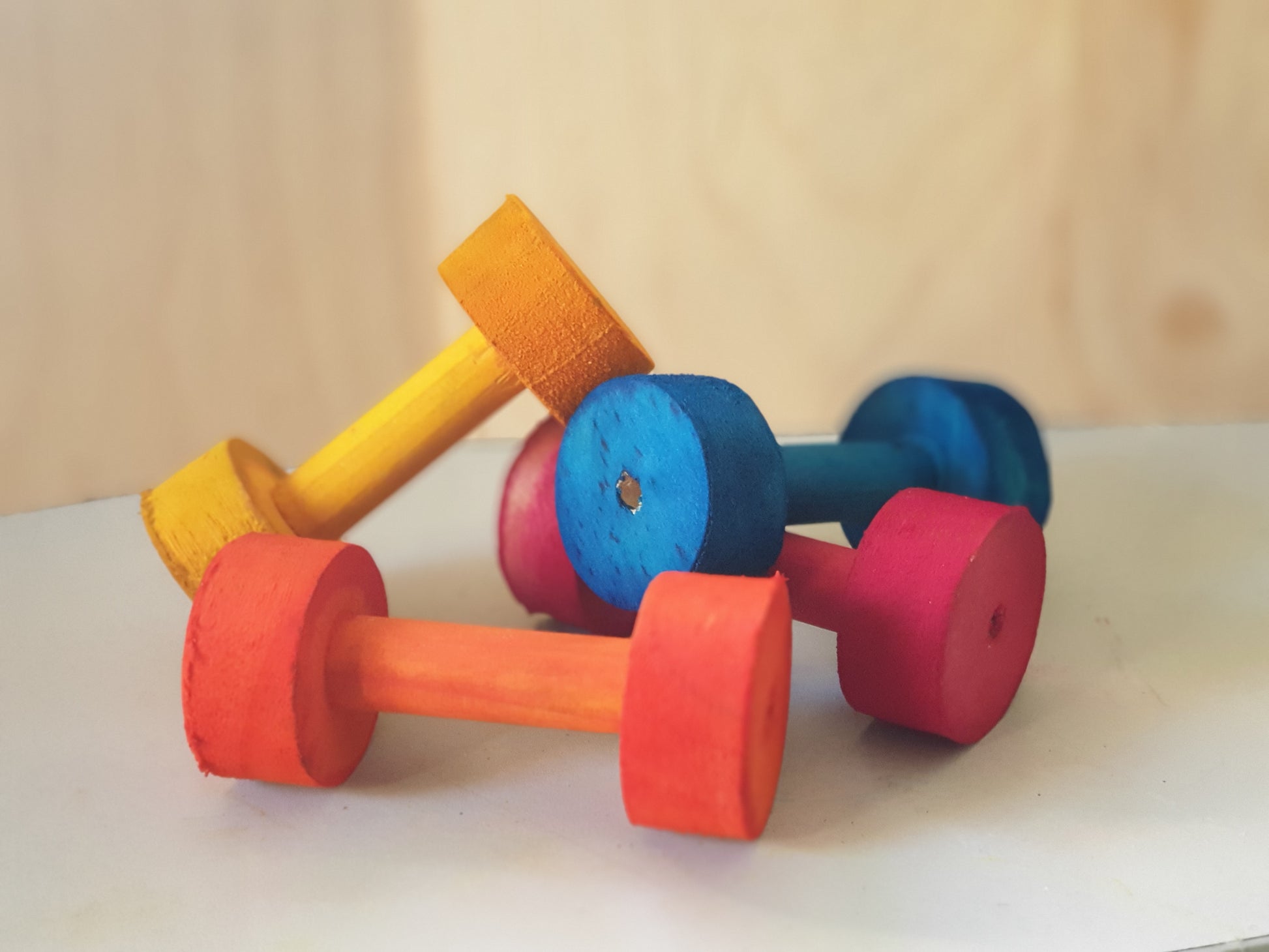 various different colours of kiln-dried pine wooden dumbells for chinchillas